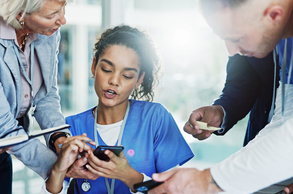 Woman, nurse and multitasking with phone or medical team for pressure, chaos or deadline at busy hospital. female person, healthcare employee or demanding colleagues with workload or tasks at clinic